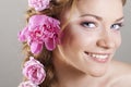 Woman with with braids and roses in hair Royalty Free Stock Photo