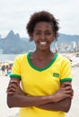 Woman in brazilian jersey with crossed arms at Rio de Janeiro Royalty Free Stock Photo