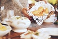 Woman, bread basket and food at dinner table in home, house and dining room for family lunch, meal and hosting social Royalty Free Stock Photo