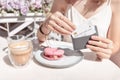 Woman after breakfast in a cafe pays with a credit card Royalty Free Stock Photo