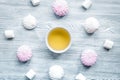 Woman breakfast with tea and marsh-mallow light wooden table top view Royalty Free Stock Photo