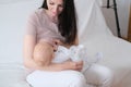 A woman is breastfeeding her newborn son. Mother pumps milk into bottles with an automatic breast pump