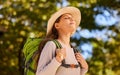 Woman, breath and backpacking in nature travel for calm, peaceful and relaxing adventure. Relaxed female traveler