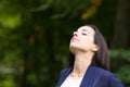 Woman breathing fresh air in nature