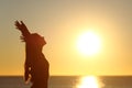 Woman breathing fresh air at sunset Royalty Free Stock Photo