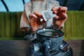 Woman brewing a fresh mug of tea with teabag in cafe Royalty Free Stock Photo