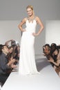 Woman In Bridalwear standing On Fashion Catwalk