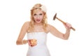 Woman bride with hammer about to smash piggy bank Royalty Free Stock Photo