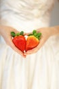 Woman bride hands holding some strawberries in her hands