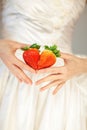 Woman bride hands holding some strawberries in her hands