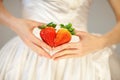 Woman bride hands holding some strawberries in her hands