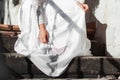 Woman bride in white wedding dress on staircase. Girl with glamour look. Fashion model. Royalty Free Stock Photo