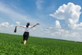 Woman with a briefcase walking on grass Royalty Free Stock Photo