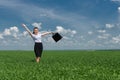 Woman with a briefcase walking on grass Royalty Free Stock Photo