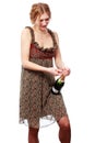 Woman in bright dress opening a bottle of champagne Royalty Free Stock Photo