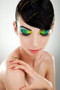 Woman with bright manicure and makeup