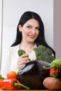 Woman with broccoli and vegetables