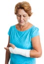 Woman with a broken arm on a plaster cast Royalty Free Stock Photo