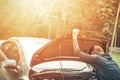 A woman with a broken car and she open bonnet. Royalty Free Stock Photo