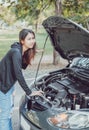 A woman with a broken car and she open bonnet Royalty Free Stock Photo
