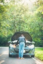 A woman with a broken car and she open bonnet Royalty Free Stock Photo