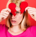 Woman with broken paper heart. Divorce and breakup concept. Relationship problems and lonliness. Royalty Free Stock Photo