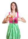 Woman with brown hair recommending the bavarian pretzel Royalty Free Stock Photo