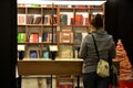 Woman browses books at bookshop