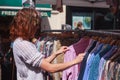 Woman browsing clothes at market Royalty Free Stock Photo