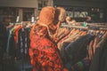 Woman browsing jackets at market Royalty Free Stock Photo