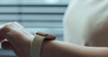 Woman browsing modern smart watches in closeup. Smart watch on female wrist. Girl making gestures on a smartwatch.