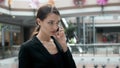 Woman brunette with phone smiling close up portrait. Young business woman professional happy. Beautiful multiethnic Royalty Free Stock Photo