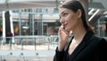 Woman brunette with phone smiling close up portrait. Young business woman professional happy. Beautiful multiethnic Royalty Free Stock Photo