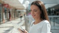 Woman brunette with phone smiling, close up. Young business woman professional happy. Beautiful multiethnic brunette Royalty Free Stock Photo