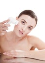 Woman with brush for deep cleansing facial. Royalty Free Stock Photo