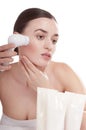 Woman with brush for deep cleansing facial. Royalty Free Stock Photo