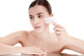 Woman with brush for deep cleansing facial. Royalty Free Stock Photo