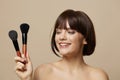 woman brushe cosmetics attractive look posing cropped view Royalty Free Stock Photo