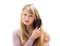 Woman brushing her hair Royalty Free Stock Photo