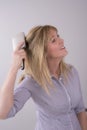 Woman brushing her hair Royalty Free Stock Photo