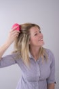 Woman brushing her hair Royalty Free Stock Photo