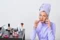 Woman brushing her teeth and talking on the phone