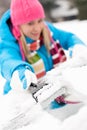 Woman brushing snow from car windscreen winter Royalty Free Stock Photo