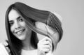 Woman brushing straight natural hair with comb. Girl combing long healthy hair with hairbrush. Hair care beauty concept Royalty Free Stock Photo