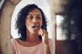 Woman, brushing teeth and oral hygiene in mirror in routine, bathroom and dental care for healthcare. Female, reflection Royalty Free Stock Photo