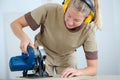 Woman builder with earmuffs Royalty Free Stock Photo