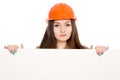 Woman builder in a helmet with a blank banner. Royalty Free Stock Photo