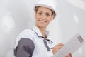 woman builder holding blueprints clipboard Royalty Free Stock Photo