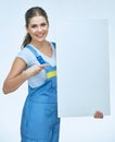 Woman builder holding white blank advertising banner point finger on copy space.