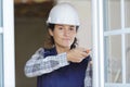 woman builder screwing window frame Royalty Free Stock Photo